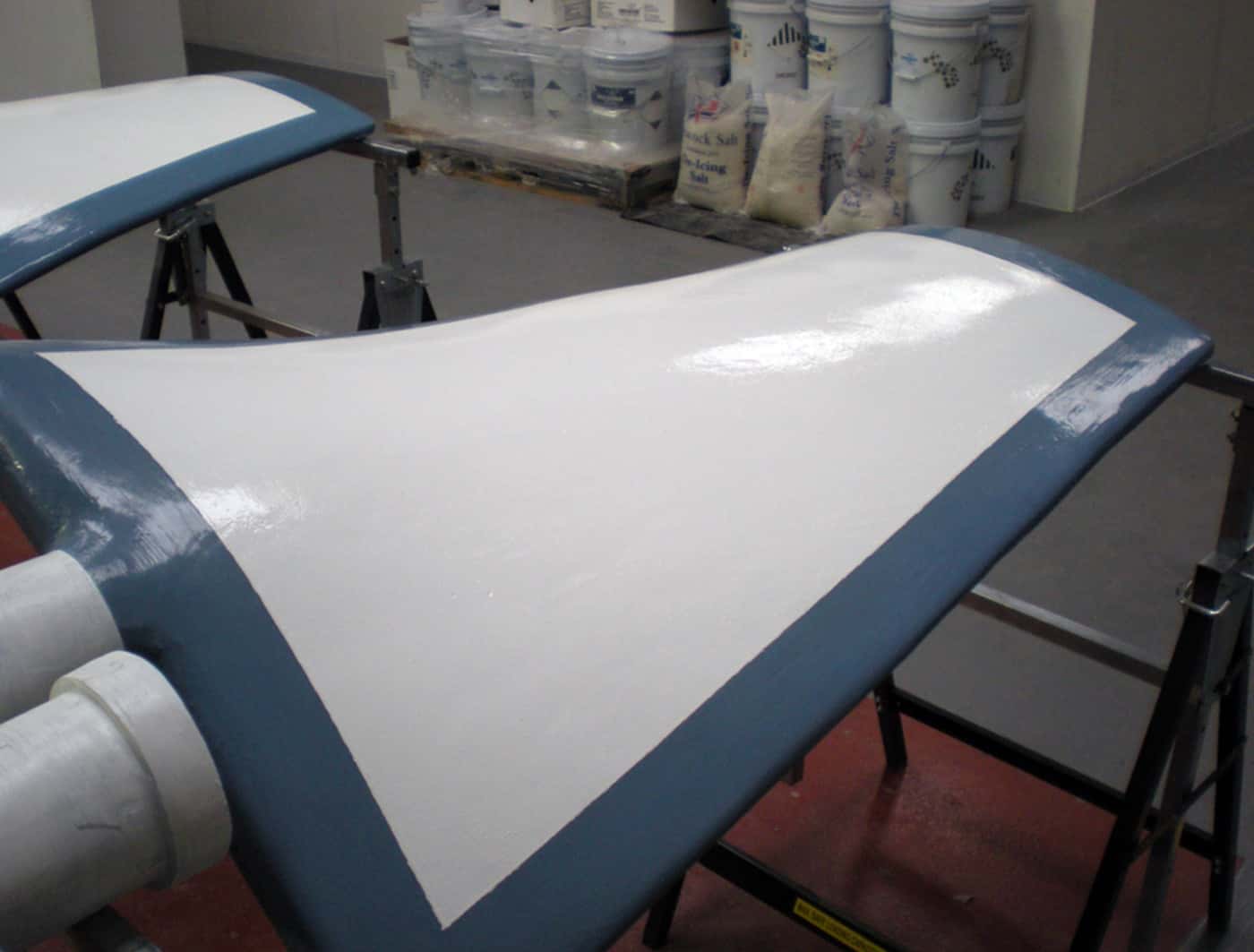 Induced draft fan blade leading edges rebuilt and coated for erosion protection by AAS